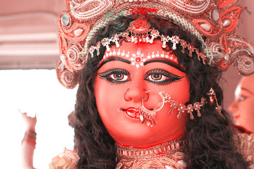 Portrait of a Hindu Mother Goddess on an altar in West Bengal, India.