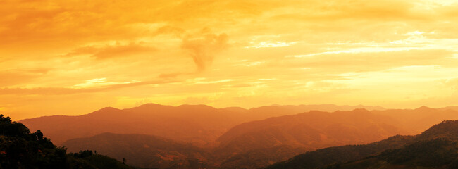 Fiery orange sunset sky with mountain view landscape. Beautiful sky panorama landscape background