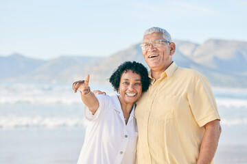 Old couple at beach, hug and travel with smile, retirement and love outdoor, vacation with view and...