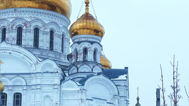 Belogorsky St. Nicholas Orthodox Missionary Monastery. Russia, Perm Krai, Belaya Gora. The temple on the hill in winter. Monastery on the background of snow. 4K