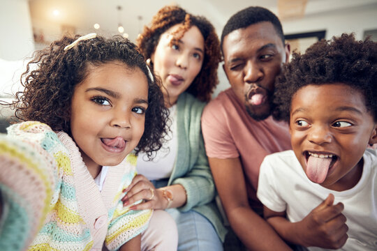 Happy, tongue and selfie with black family in living room for social media, bonding and funny face. Happiness, picture and care with parents and children at home for memory, support and weekend