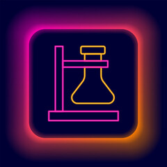 Glowing neon line Glass test tube flask on stand icon isolated on black background. Laboratory equipment. Colorful outline concept. Vector