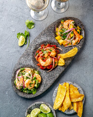 CEVICHE. Three colorful shrimps ceviche with mango, avocado and tomatoes. Latin American Mexican...