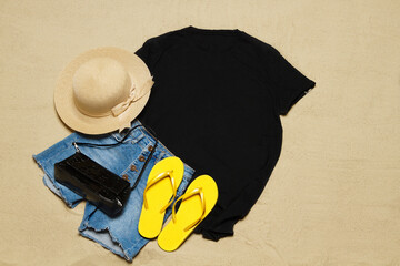 Sand beach texture background. Mockup black summer t-shirt copy space. Blank template woman shirt...