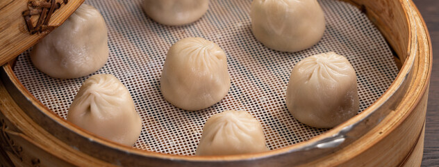 Steamed pork soup dumplings named Xiao long bao in Taiwan.