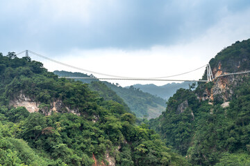 Fototapeta na wymiar See Bach Long glass bridge in Moc Chau district, Son La province, Vietnam with a total length of 632 m, this is the longest pedestrian glass bridge in the world