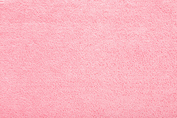 Fototapeta premium Light pink dry soft microfiber rag background. Closeup. Pastel color. Empty place for text. Top down view.