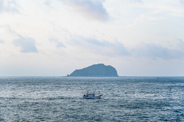 Keelung City, Taiwan - SEP 14, 2019: Ship at sea background is keelung islet.