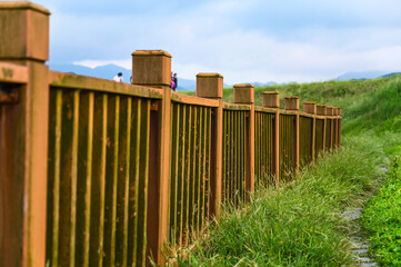 Wooden railing in the park.