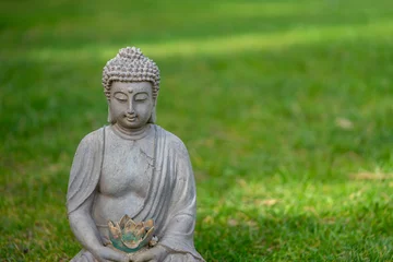 Fototapeten buddha statue in the garden © Animaflora PicsStock