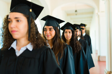 Line of young women graduating university