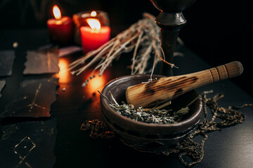 Stupa and pestle on a dark table. Halloween