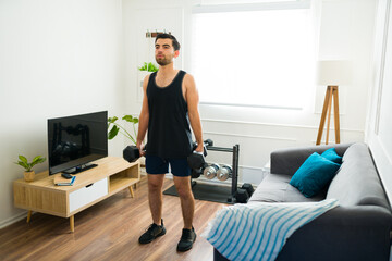 Fitness hispanic man working out lifting weights