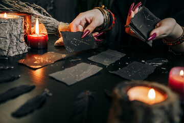 The woman's hands are holding a magic card. Halloween