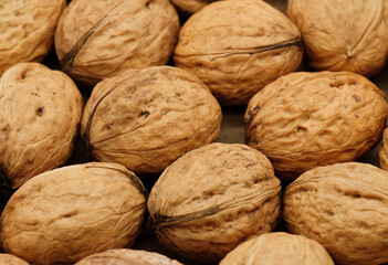 Walnut close up on a wooden table. Walnut close up. product rich in minerals and vitamins.