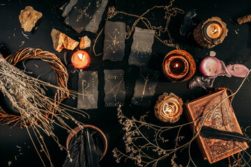 Magical items from above are spread out on a dark table. Halloween