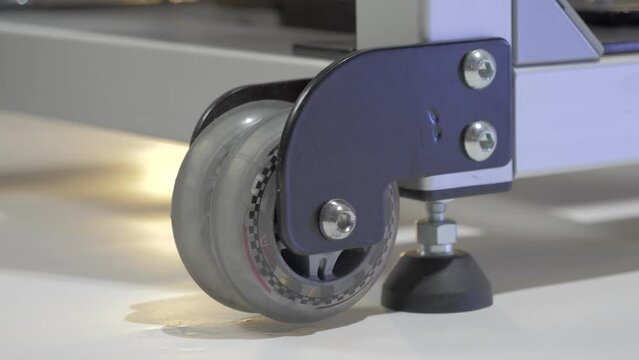 Slow motion shot of a rubber stopper and wheels on a fitness machine