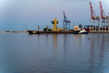 bulk carrier vessel is sailing in the port area.