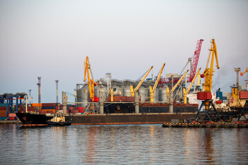 Fototapeta premium bulk carrier vessel is sailing in the port area.