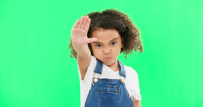 Angry child, stop and hand on green screen background with emoji and attitude. Black kid portrait in studio with space, mockup and sign for warning, power and protest to reject, defence or decline
