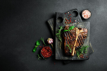 The T-bone or porterhouse steak of beef cut from the short loin. steaksT-shaped bone with meat on...