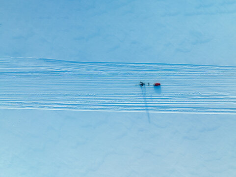 Top Down View of Arctic hiking with a pulka in Lapland - an unforgettable winter adventure through a stunning winter wonderland