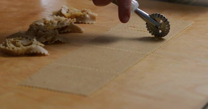 Flawless Portions: Creating Chebakia with a Pastry Cutter. Watch as Each Piece of Dough is Cut with Care and Skill
