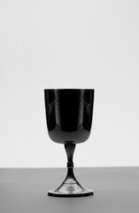 Christian chalice on altar, black and white photography
