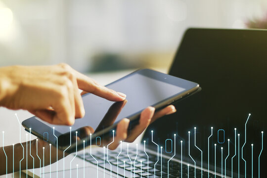 Creative abstract micro chip hologram and finger presses on a digital tablet on background, artificial intelligence and machine learning concept. Multi exposure