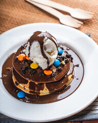pancake with ice cream and chocolate on top