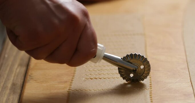 Precision in Action: Cutting Dough with a Pastry Cutter.