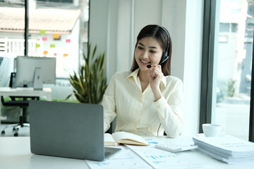 Young business asian woman working call centre customer service agents. Business female support...