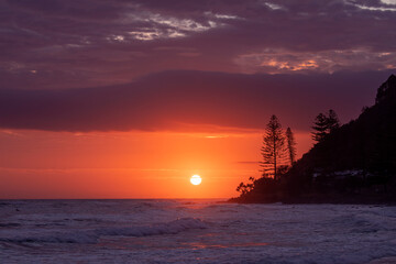Colourful ocean sunrise and clouds over Burleigh Headland, Gold Coast Australia