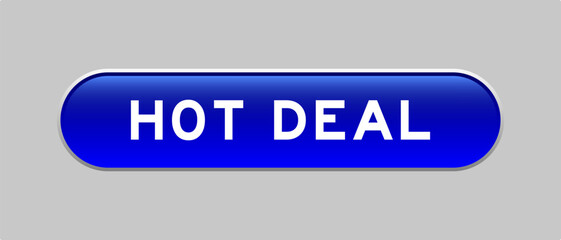 Blue color capsule shape button with word hot deal on gray background