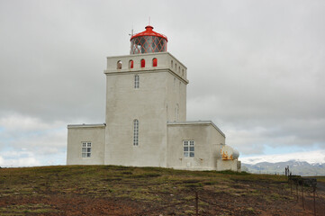 Fototapeta na wymiar Lighthouse of Dyrholaey formerly known as Cape Portland on the south coast of Iceland
