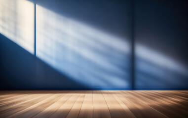 Fototapeta na wymiar Blue empty wall and wooden floor with interesting light glare. Interior background for the presentation.