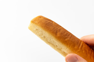 Bread sticks with butter on a white background