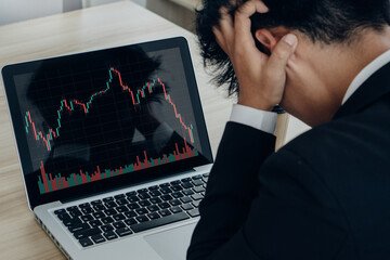 Stressed business man.Crypto trader broker.Trading decreasing chart data fall down loss, desperate about losing money of crisis, recession, inflation.