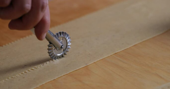 Crafting Chebakia: Expertly Using a Pastry Cutter to Shape Dough