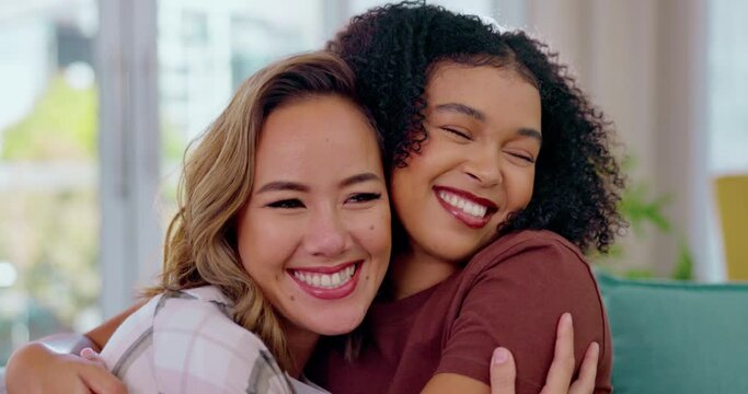 Love, diversity and women hugging on sofa with smile, happiness and solidarity in pride. Multiracial lesbian couple, woman and partner in happy embrace for support and trust together in living room.
