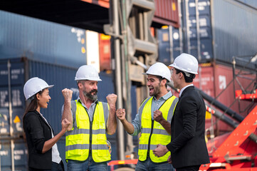 group of businessman, Logistics engineer and inspector and businessman cheer up  and happy to about success business deal and project in shipping containerin commercial transport port