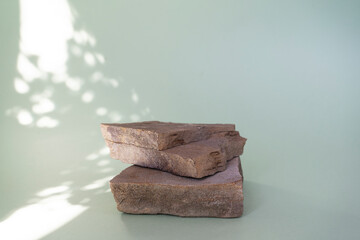 Background stone podium for cosmetic products of natural color.  Front view.