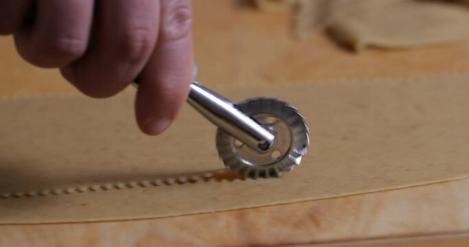 Art of Precision: Using a Pastry Cutter to Sculpt Dough for Chebakia. Every Cut Reflects Culinary Mastery and Attention to Detail