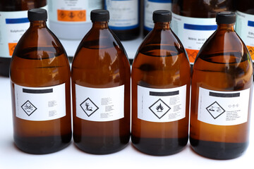 Hazardous chemicals and symbols on containers in factory