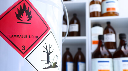 Hazardous chemicals and symbols on containers in factory