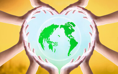  earth day concept, Heart shape of hands holding earth globe over blurred global warming background. Elements of this image furnished by NASA