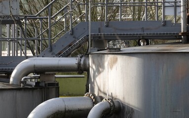 close-up of pipes and container of a sewage plant