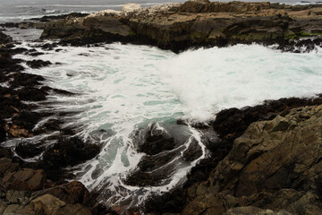 waves breaking on rocks