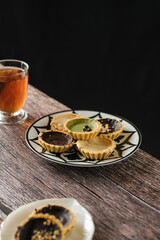 pie susu, milk pie, chocolate and matcha in mini size on the table