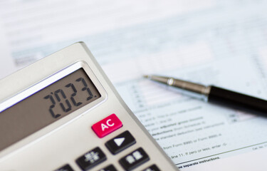 Individual income tax return form for tax payment on working desk. Calculation tax return in 2023